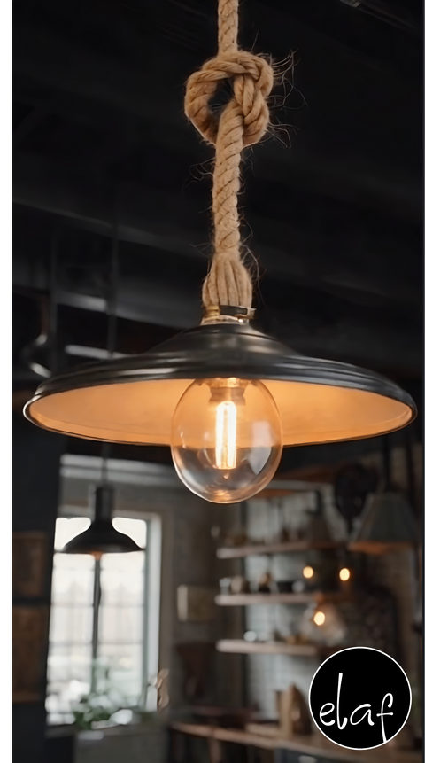 Rustic hanging pendant light with knotted natural rope and black metal shade, vintage bulb hanging from twisted cord