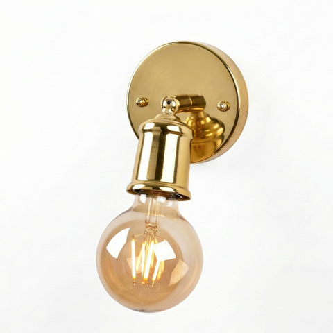 Gold wall-mounted light fixture with a lit bulb on a white background